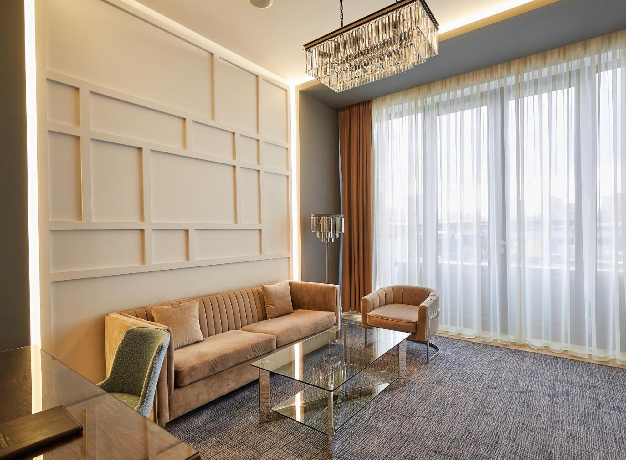 Aghababyan'S Hotel Yerevan Exterior photo A living room in a suite at the hotel